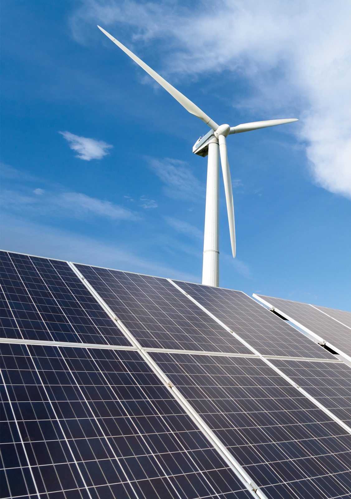 Wind turbine above a utility-scale solar array